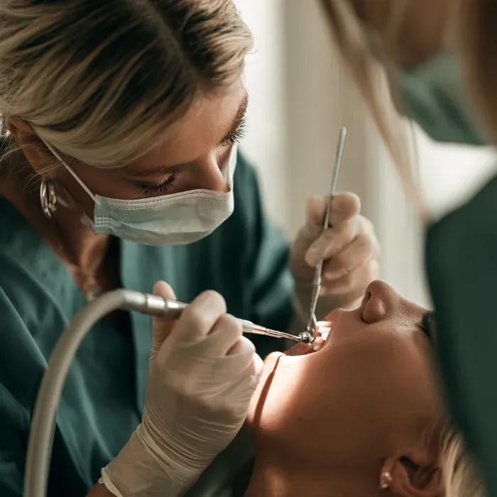 Dentist examining a patient’s teeth